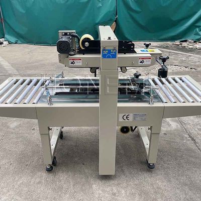 220V / 50HZ স্বয়ংক্রিয় প্যাকিং মেশিন 12mm কার্টন বক্স সিলার আঠালো টেপিং